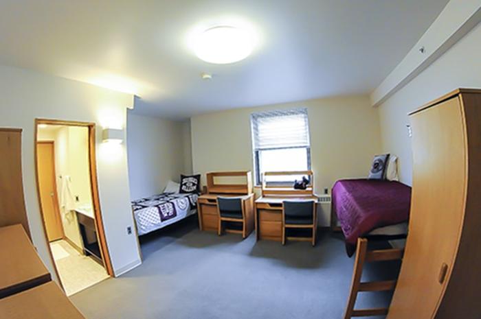 McGill House Semi-Suite Double - two desks beds a dresser and doorway to bathroom